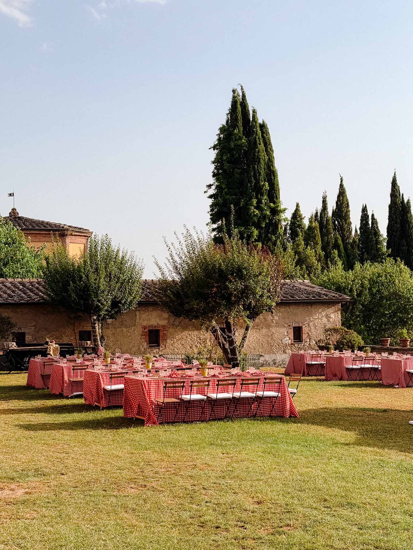 Courtyard tables prepared for an informal gathering at Villa Catignano.