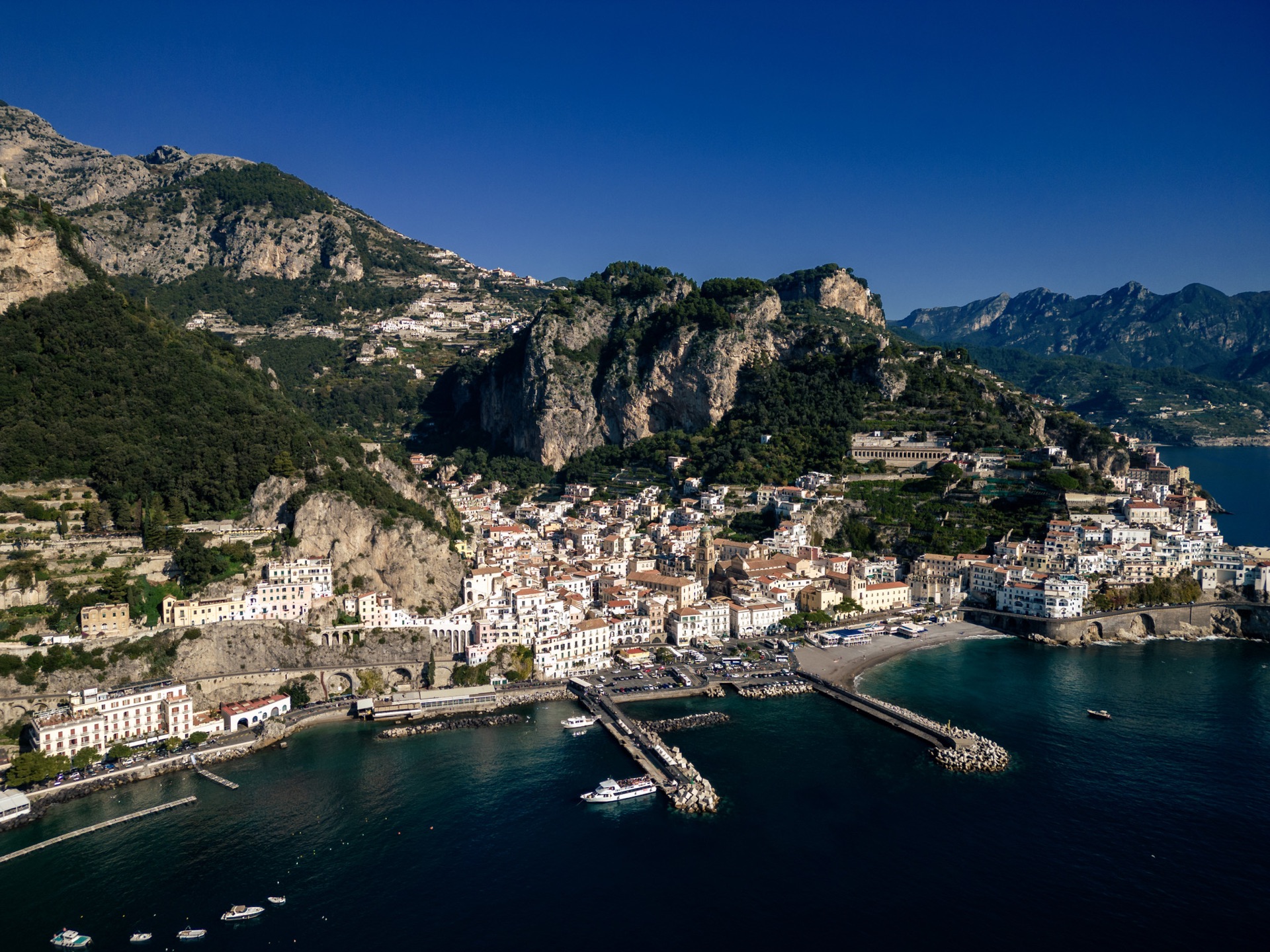 The Amalfi coastline, harbour and mountains seen from above