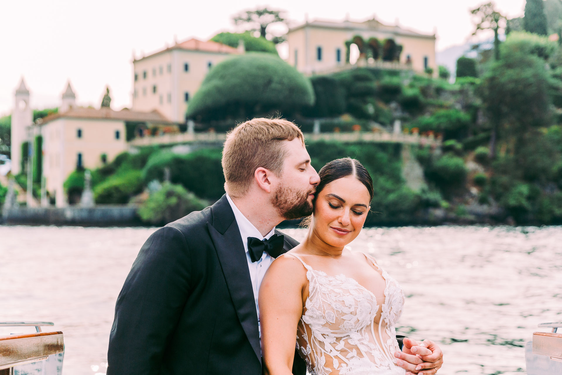 Ryan kisses Victoria on the forehead while they sit in a boat